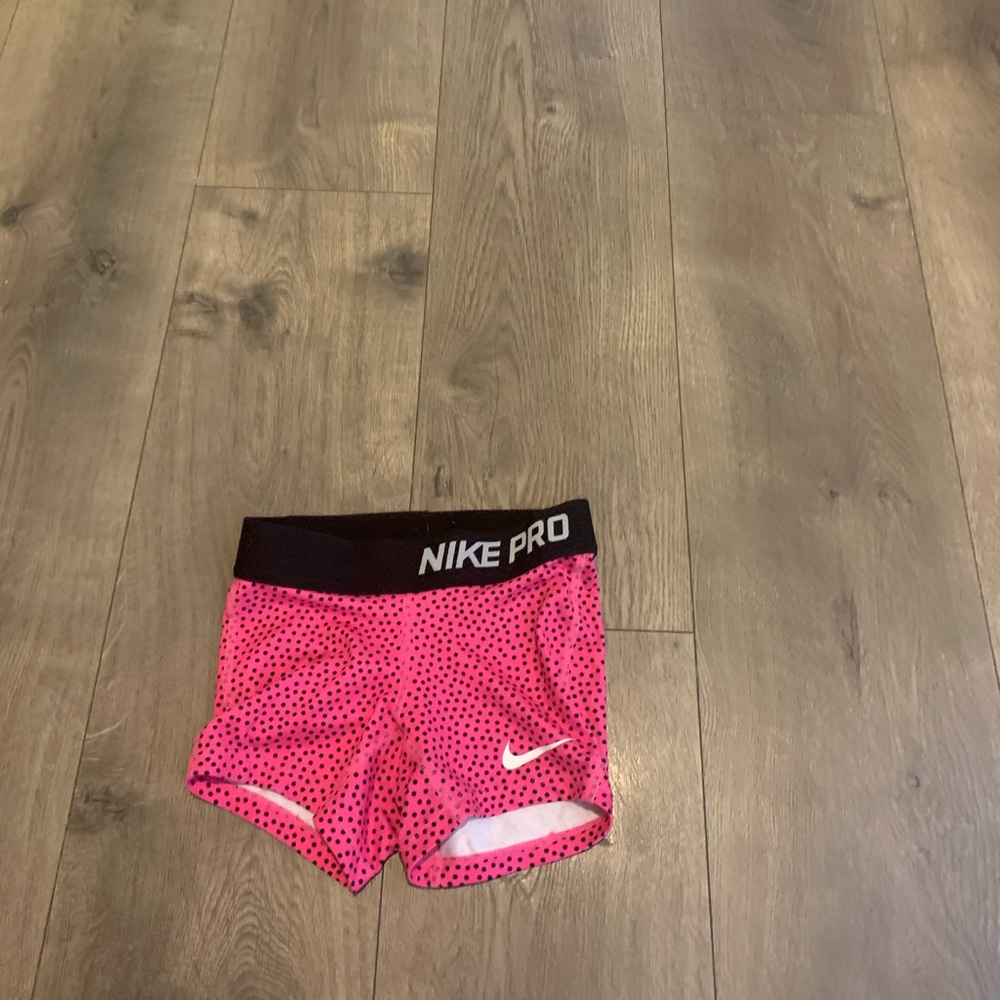 Outgrown Nike pink and black booty shorts